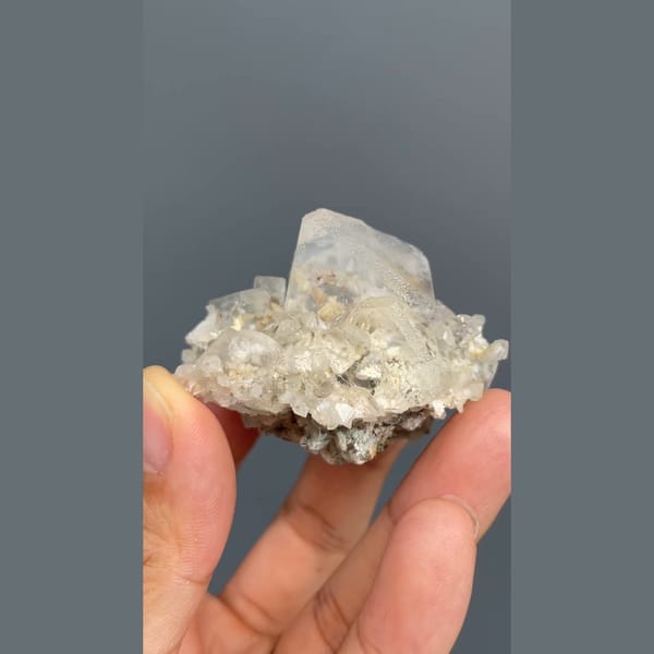 Colourless fluorite crystal on a sparkling matrix from Inner Mongolia — detail view