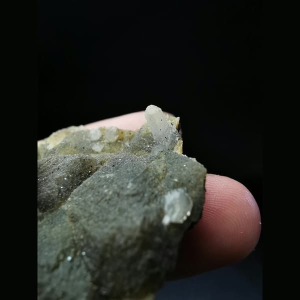 Two-tone garnet with a little quartz and calcite — alternate view