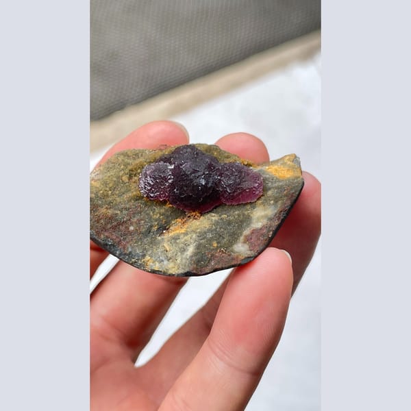 Deep purple fluorite crystals on dark matrix from Henan — alternate view