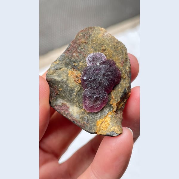 Deep purple fluorite crystals on dark matrix from Henan — alternate view