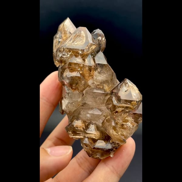 Skeletal smoky quartz cluster with ochre coating from Namibia — alternate view