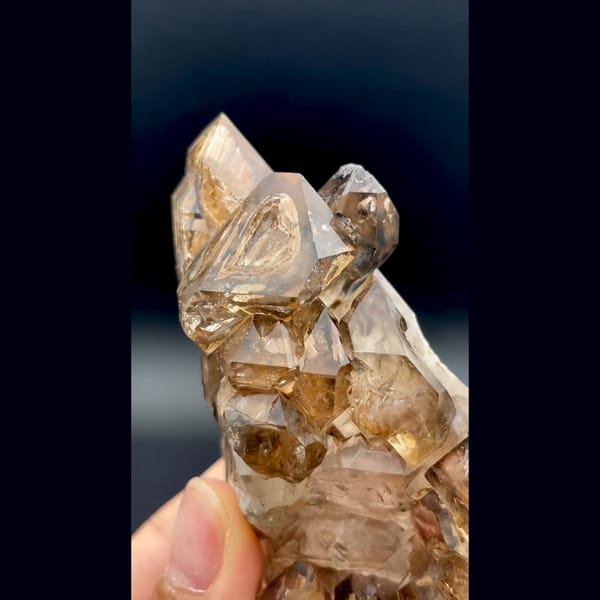 Skeletal smoky quartz cluster with ochre coating from Namibia — detail view
