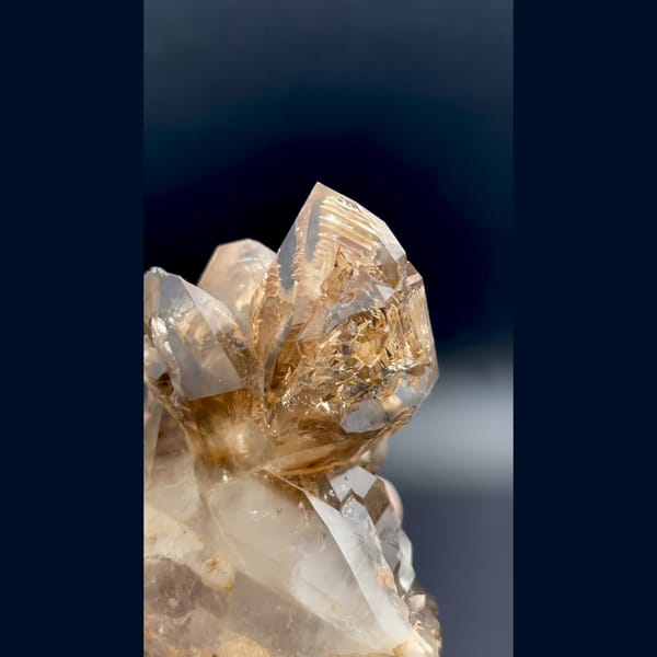 Skeletal smoky quartz cluster with ochre coating from Namibia — detail view