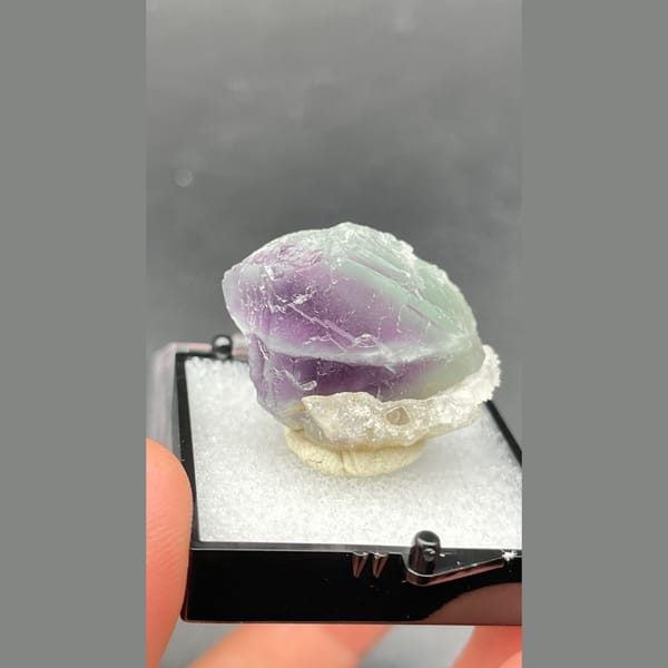 Small purple and pale green banded fluorite from Zhejiang — complete view