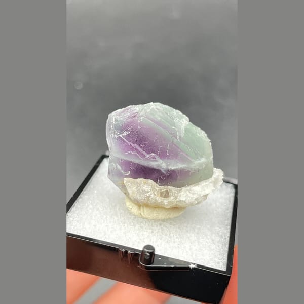 Small purple and pale green banded fluorite from Zhejiang — alternate view
