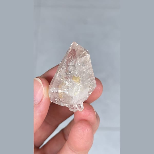 Small clear quartz crystal with inclusions from Yunnan — detail view