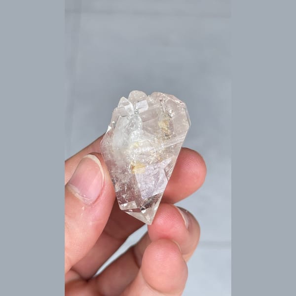 Small clear quartz crystal with inclusions from Yunnan — detail view