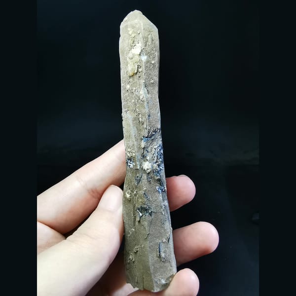 Large grey quartz with white calcite balls and hematite — complete view
