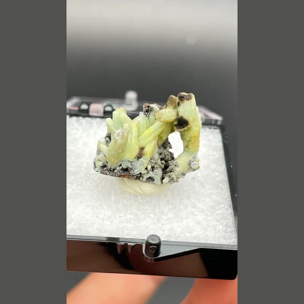 Yellow-green plumbogummite crystals on dark matrix from Guangxi — complete view