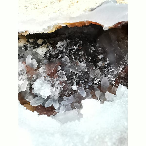 Red and white Brazilian agate geode with lid — detail view