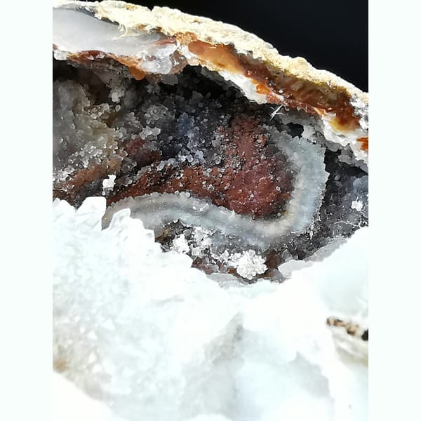 Red and white Brazilian agate geode with lid — detail view