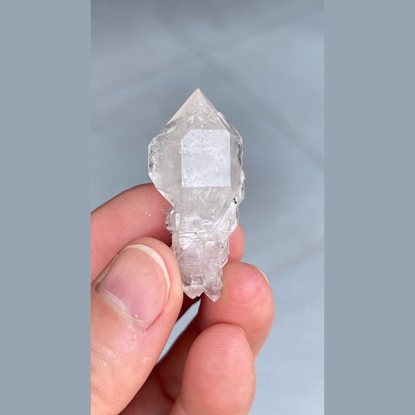 Clear quartz crystal with an unusual irregular form from Yunnan — complete view