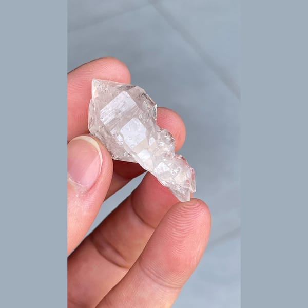 Clear quartz crystal with an unusual irregular form from Yunnan — detail view