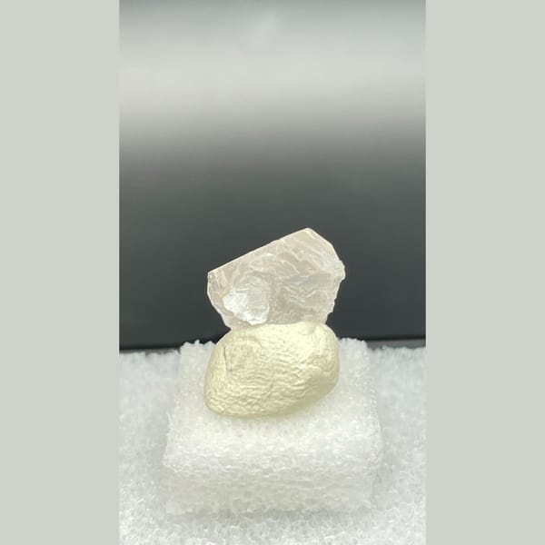 Tiny colourless fluorite crystal with mica from Pakistan — detail view