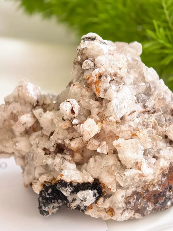 Calcite Crystals on Dark Limonite Matrix — Guizhou — individual mineral specimen view 1
