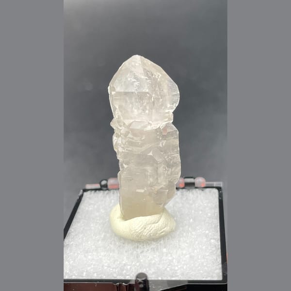 Clear quartz crystal with a sceptre-like stepped form from Yunnan — complete view