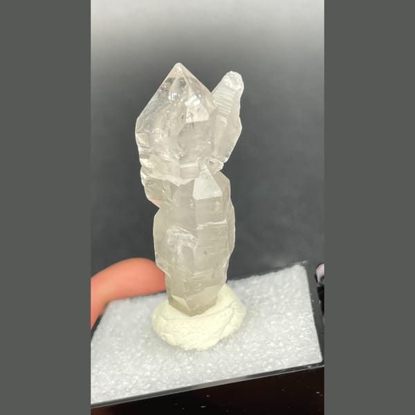 Clear quartz crystal with a sceptre-like stepped form from Yunnan — alternate view