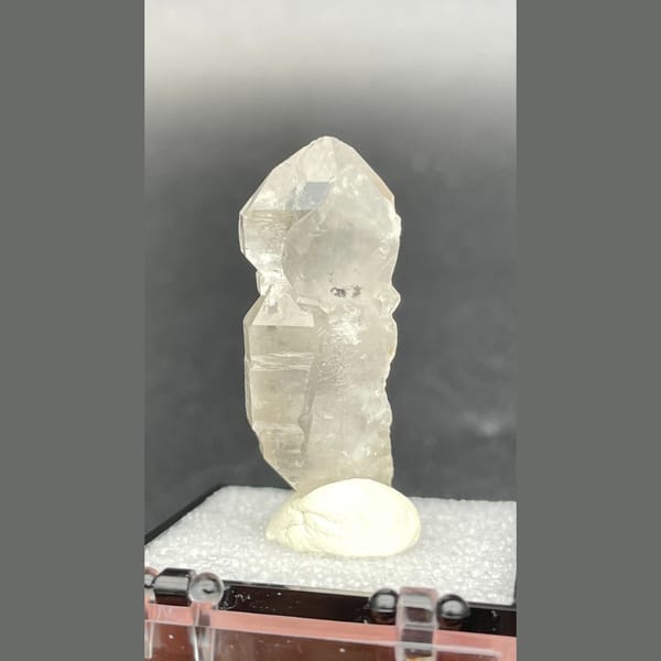 Clear quartz crystal with a sceptre-like stepped form from Yunnan — alternate view