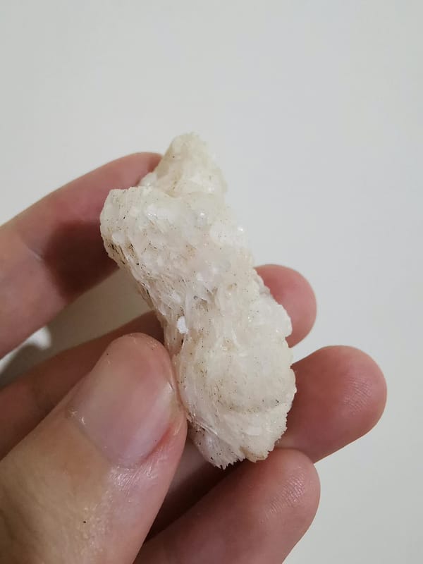 Pale pink calcite floater cluster, reverse view