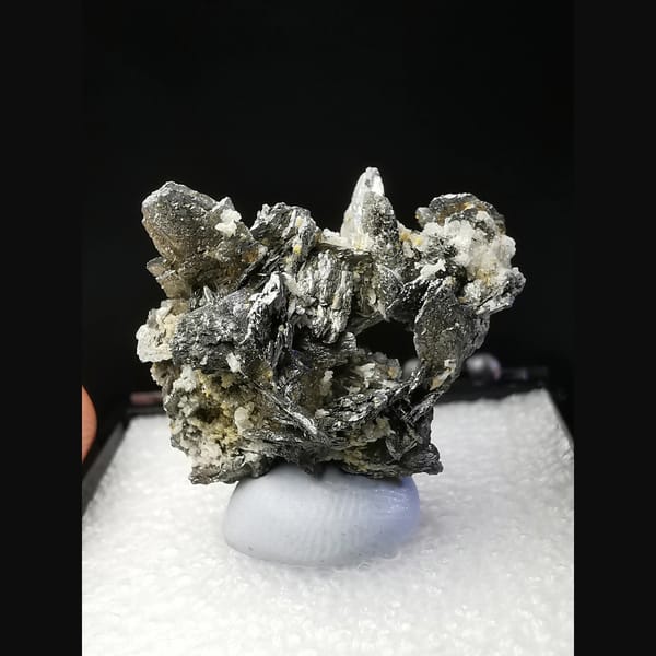 Wing-like platy loellingite crystal cluster — complete view