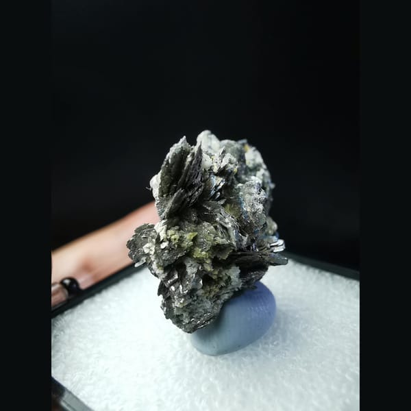 Wing-like platy loellingite crystal cluster — detail view