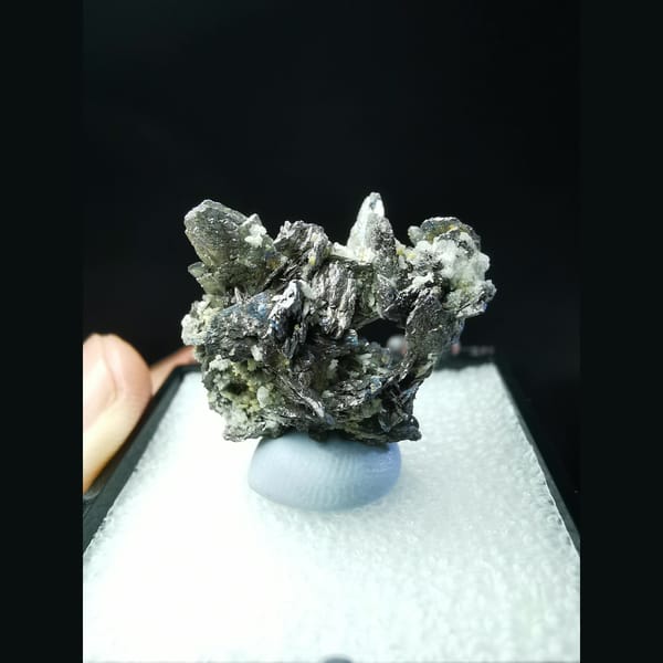 Wing-like platy loellingite crystal cluster — detail view