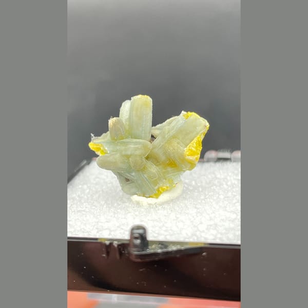 Yellow-green plumbogummite crystals with bright yellow tips from Guangxi — alternate view