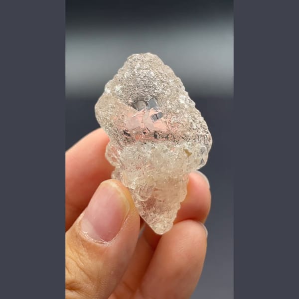 Clear naturally etched topaz crystal from Yunnan — alternate view