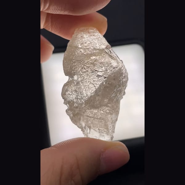 Clear naturally etched topaz crystal from Yunnan — alternate view