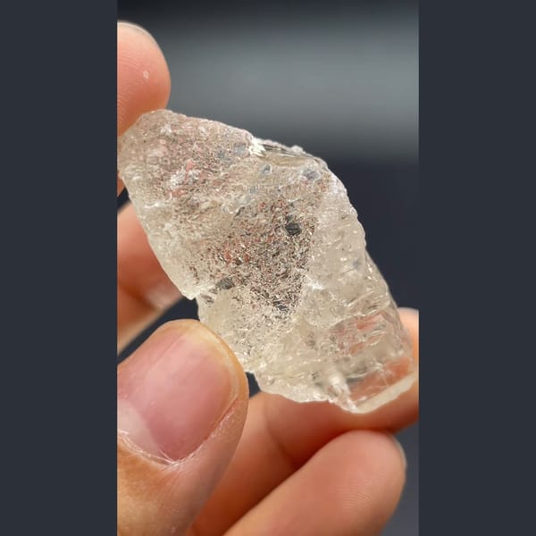 Clear naturally etched topaz crystal from Yunnan — detail view