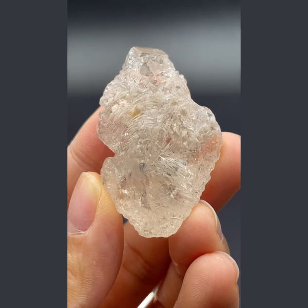 Clear naturally etched topaz crystal from Yunnan — detail view