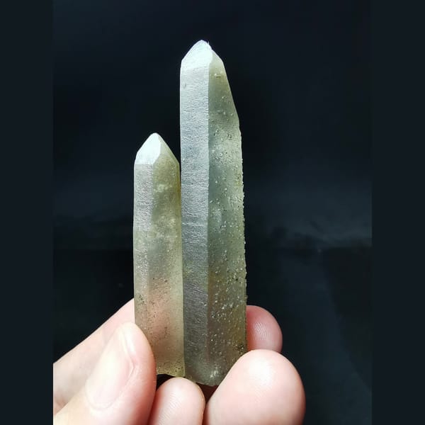 Two quartz crystals with hollow-core tops — complete view