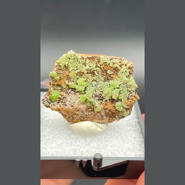 Bright green pyromorphite crystals on brown matrix from Guangxi — complete view
