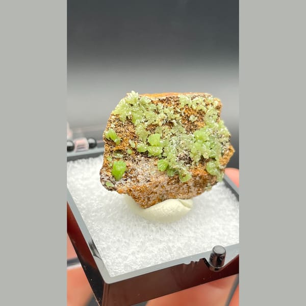 Bright green pyromorphite crystals on brown matrix from Guangxi — alternate view