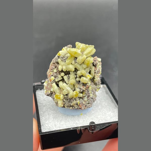 Bright yellow-green plumbogummite on grey-brown matrix from Guangxi — complete view