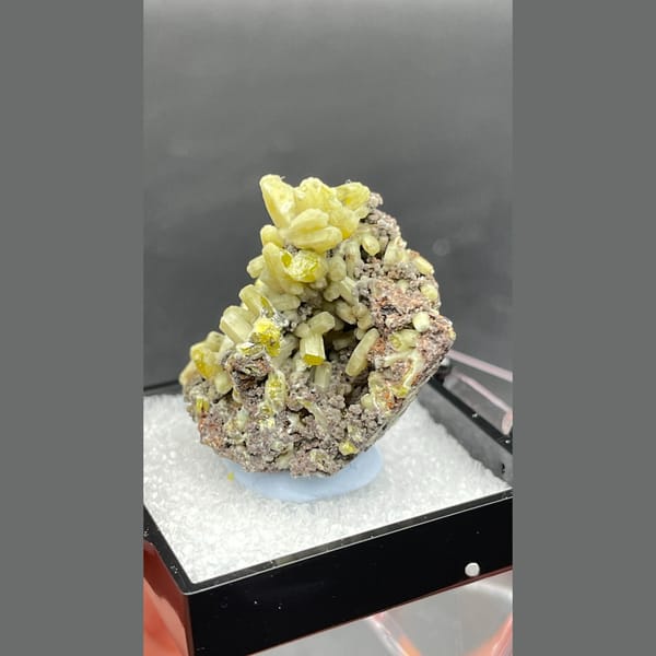 Bright yellow-green plumbogummite on grey-brown matrix from Guangxi — alternate view