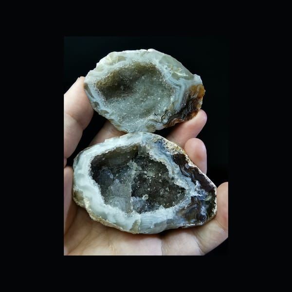 Complete open view of both halves of the exact Brazilian agate geode pair