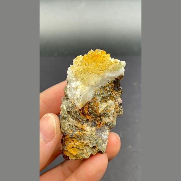 Orange-yellow pyromorphite with white quartz on brown matrix from Guangxi — detail view