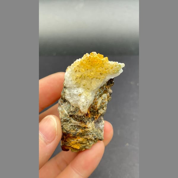 Orange-yellow pyromorphite with white quartz on brown matrix from Guangxi — detail view