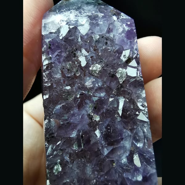 Polished Uruguayan amethyst tower with crystal flowers — alternate view