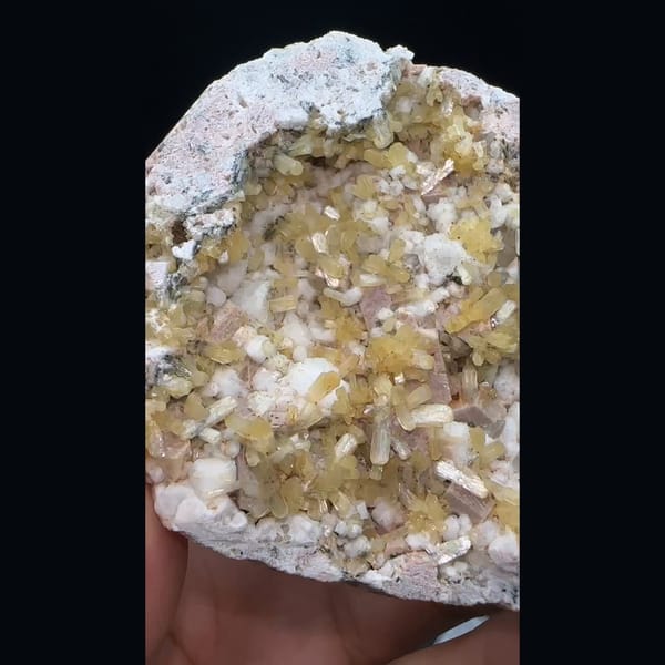 Yellow stilbite sprays with feldspar and quartz on a plate from Yunxiao, Fujian — alternate view