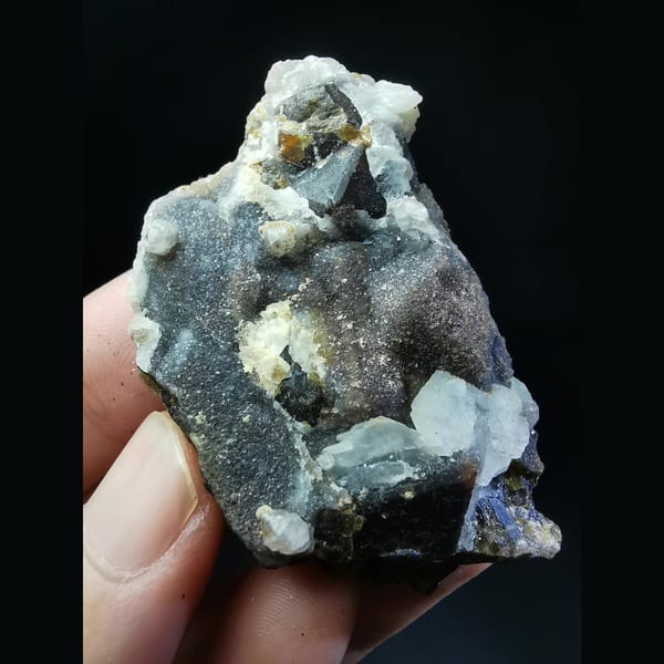 Sugar-coated garnet with white calcite — complete view