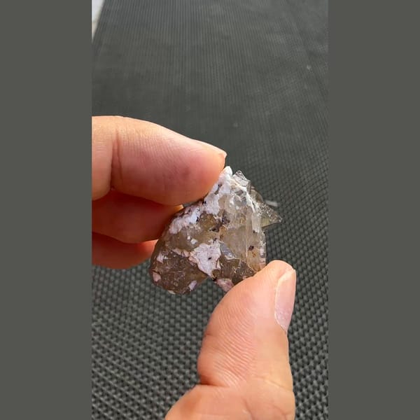 Tall smoky quartz point with smaller crystals from Yunxiao, Fujian — detail view