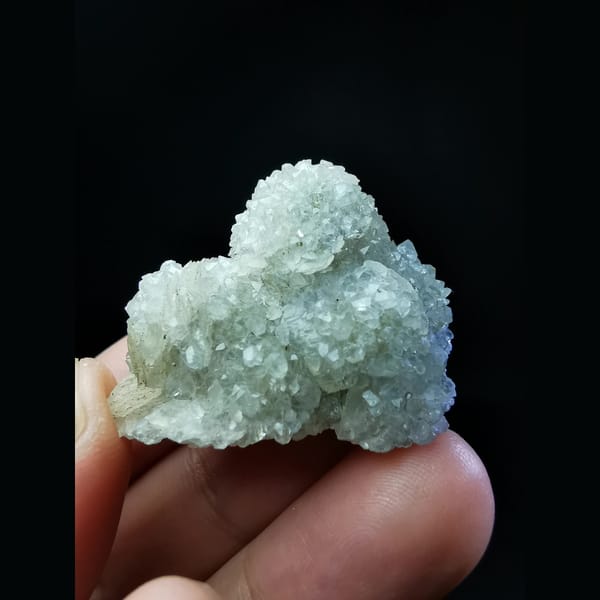 Sparkling quartz balls encasing calcite — complete view