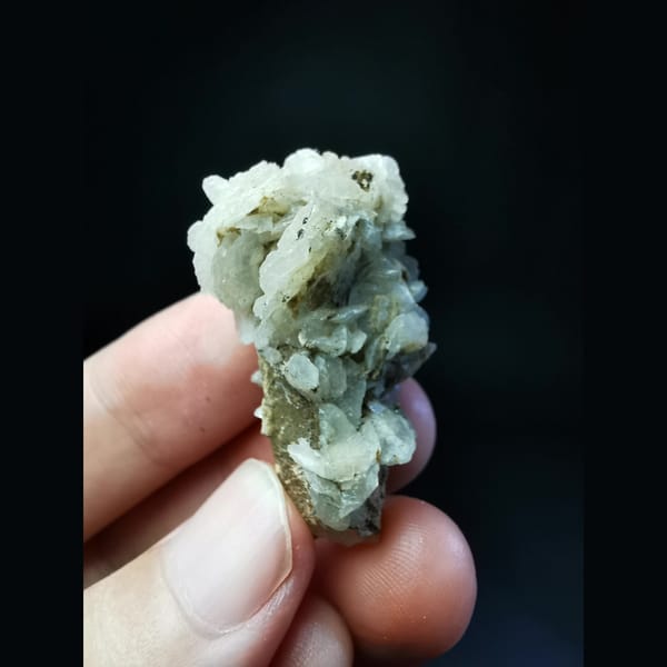 Quartz with a large white calcite flower ball — detail view