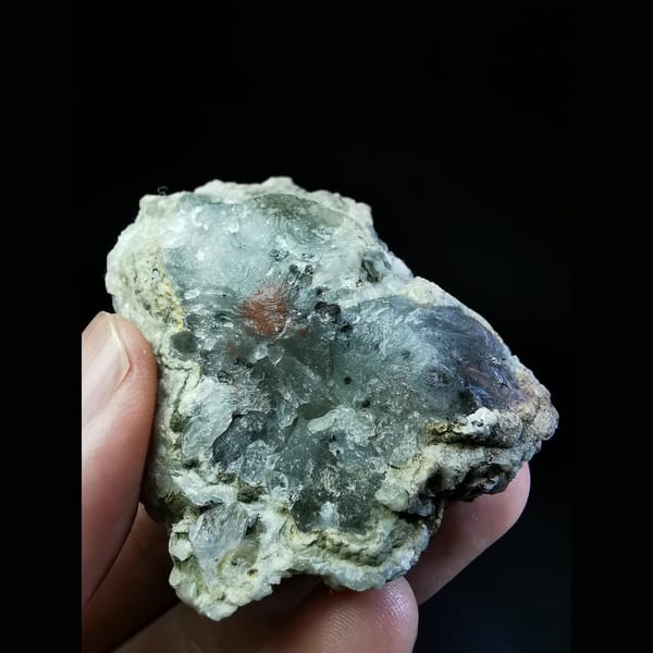 White calcite flowers on quartz — detail view