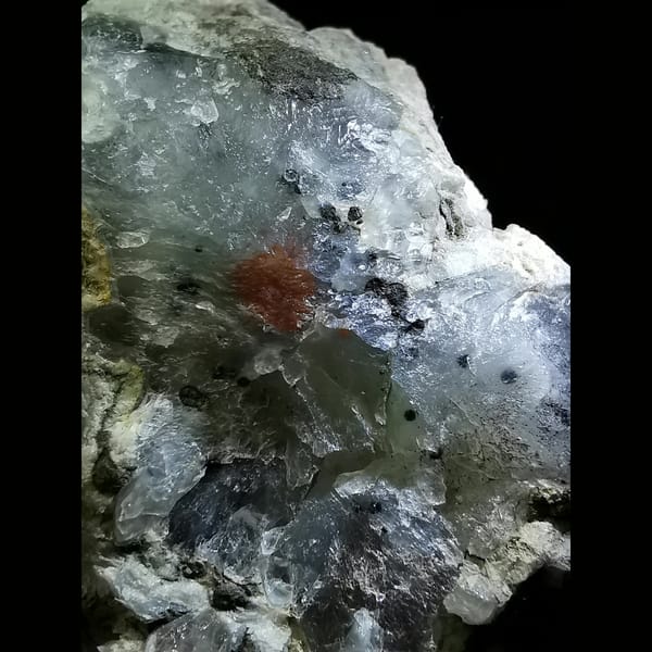 White calcite flowers on quartz — detail view