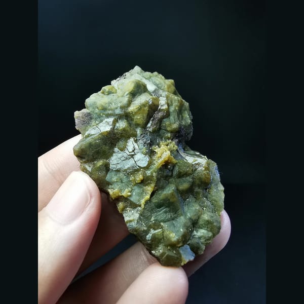 Yellow-green andradite garnet cluster — complete view