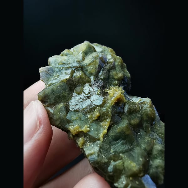 Yellow-green andradite garnet cluster — detail view