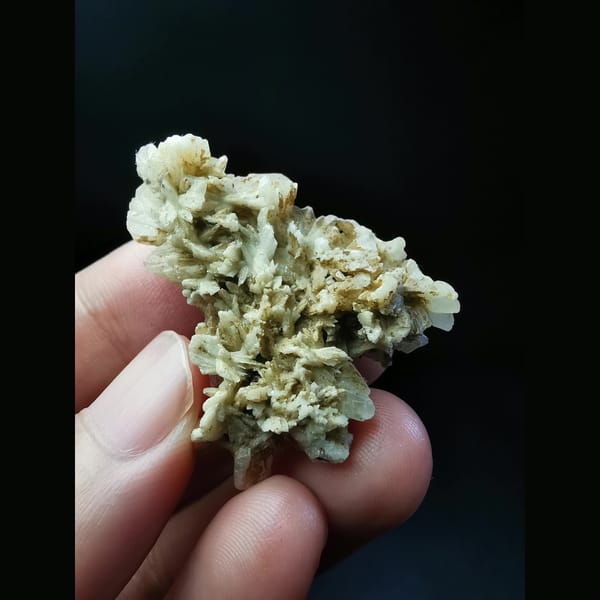 Floater cluster of off-white dogtooth calcite — alternate view